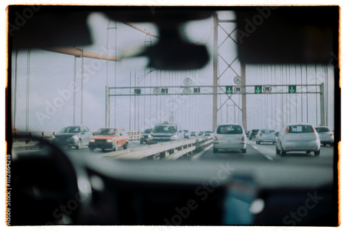 View from the car on the bridge on 25 de Abril Bridge, Lisbon, on film photo