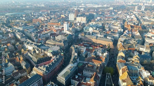 Strasbourg, the capital of Christmas, sparkles during Advent, with its stunning decorations and festive ambiance. This aerial view features the majestic Strasbourg Cathedral, La Petite France  photo