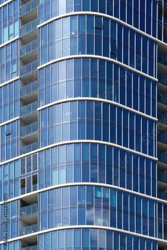 Modern glass building facade with curved design in Southbank Melbourne photo