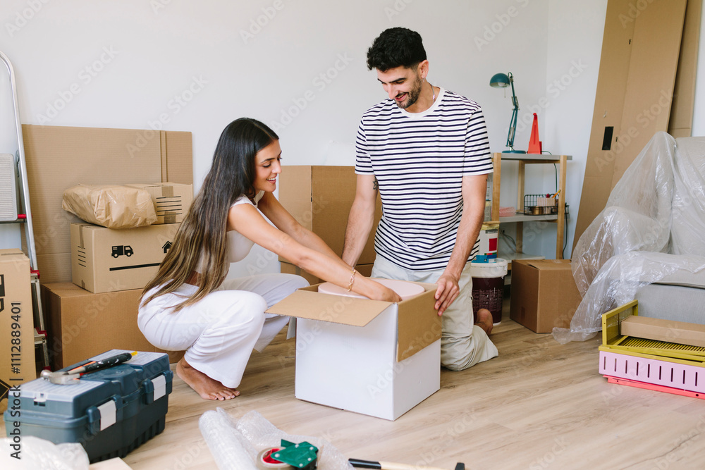 Couple Unpacking After Moving Couple Unpacking After Moving