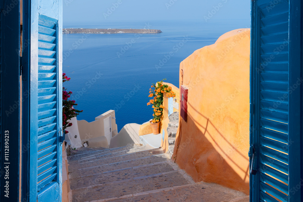 Fototapeta premium street and wooden gates against volcano caldera, beautiful details of Santorini island, Greece