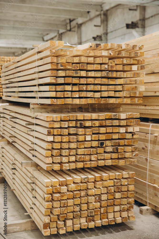 Stacks of square timber planks forming geometric pattern in lumber warehouse Stacks of square timber planks forming geometric pattern in lumber warehouse