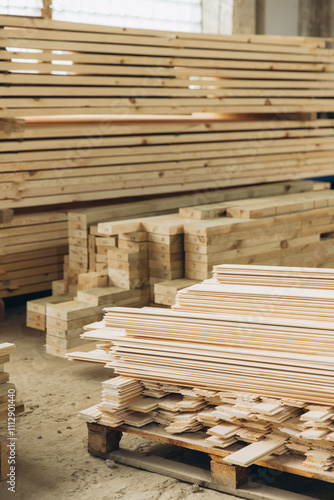 Stacks of lumber forming walls in a woodworking factory for modular building industry photo