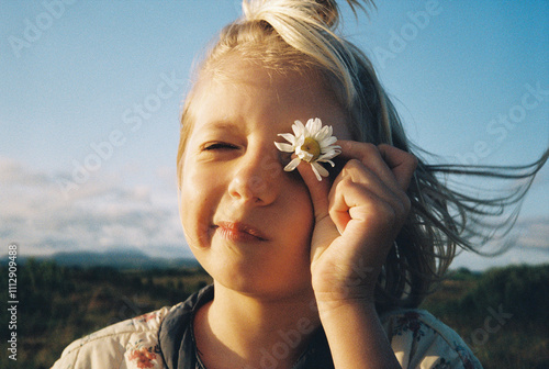 A girl with a white flower photo