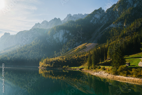 Scenic view of idyllic lake in Alps in autumn on sunny day  photo