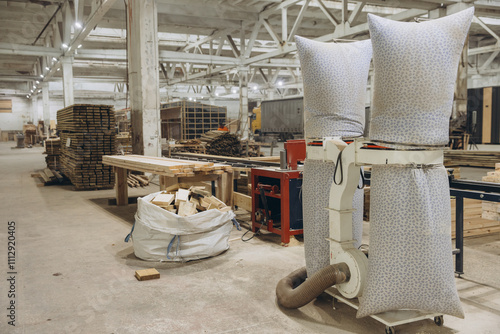 Fotografie Wood dust collector machine extracting sawdust in a carpentry workshop