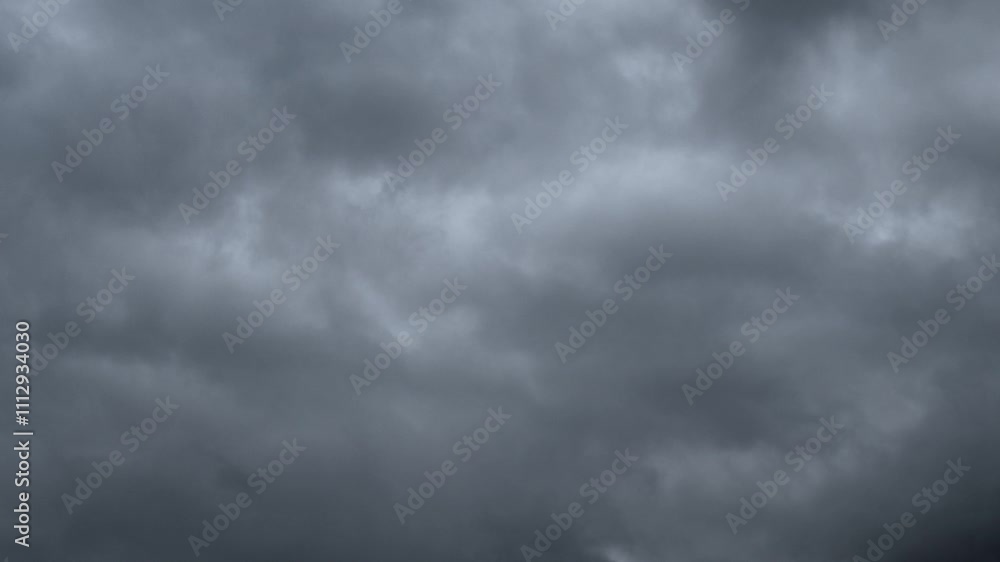 Time lapse of gray rain clouds churring about a silhouette skyline of evergreen trees
Time lapse of gray rain clouds churring about a silhouette skyline of evergreen trees