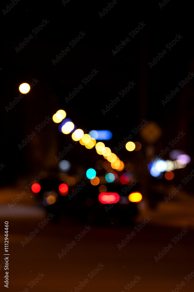 Abstract pattern of glowing multicolored lights on a dark background Abstract pattern of glowing multicolored lights on a dark background