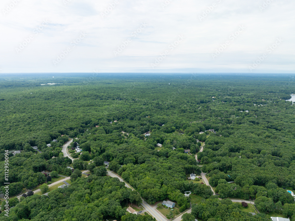 Obraz premium Aerial view of Suburban neighborhood in Sharon, Norfolk County, Massachusetts, with green forest and big villa.