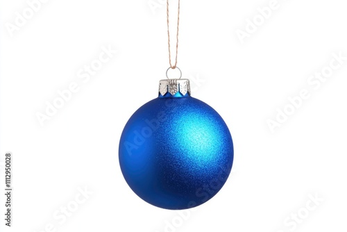 A blue Christmas ornament hanging from a string