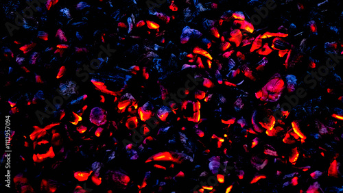 abstract background red and blue lights of a smoldering fire on a black background