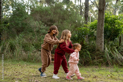 Sibling playing together in the wood. photo