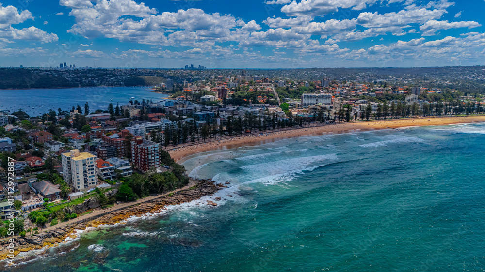 Fototapeta premium Aerial View of Manly Beach and Sydney harbour with manly houses on a warm summer day blue skies Sydney NSW Australia