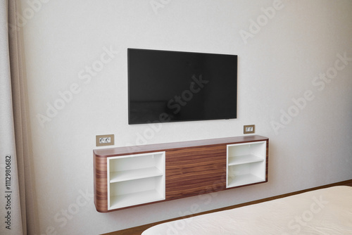 A Modern WallMounted TV Unit in a Stylishly Designed and Aesthetic Room Environment photo