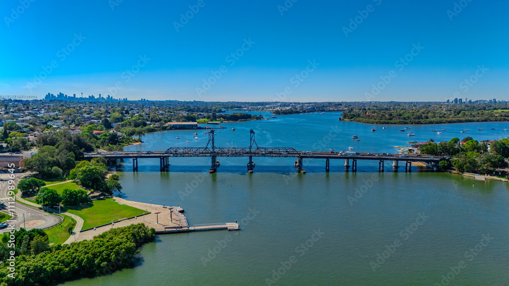 Fototapeta premium Panorama Aerial view above Rhodes with views to Meadowbank and Olympic park and Wentworth Point and Concord West with Parramatta River in Sydney NSW Australia