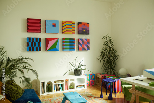 Colorful artworks hang on the living room wall photo