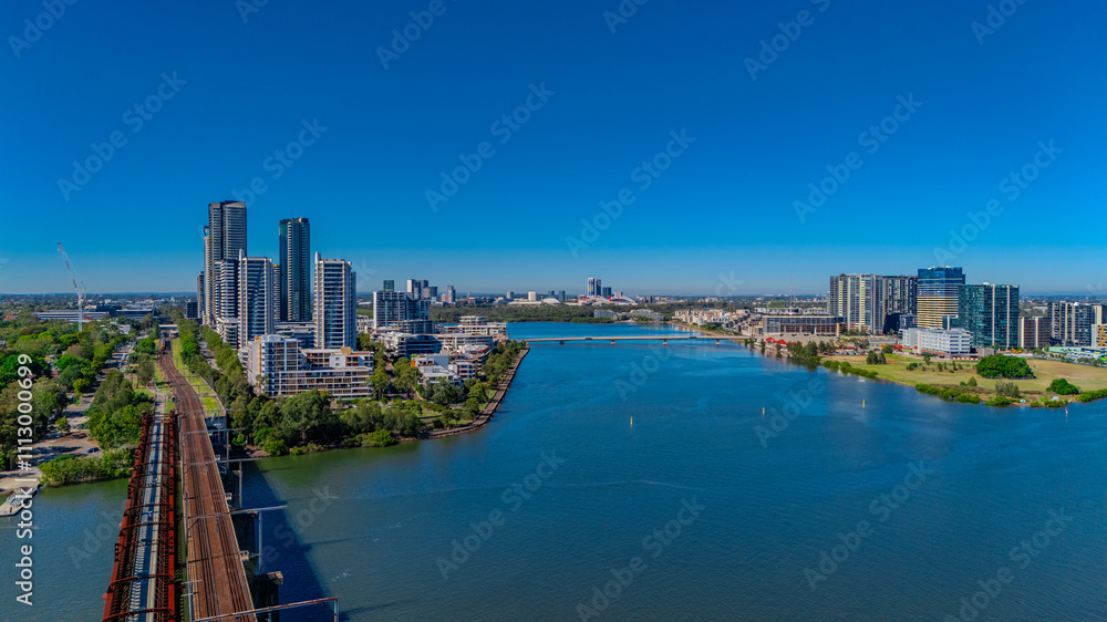 Panorama Aerial view above Rhodes with views to Meadowbank and Olympic park and Wentworth Point and Concord West with Parramatta River in Sydney NSW Australia Panorama Aerial view above Rhodes with views to Meadowbank and Olympic park and Wentworth Point and Concord West with Parramatta River in Sydney NSW Australia