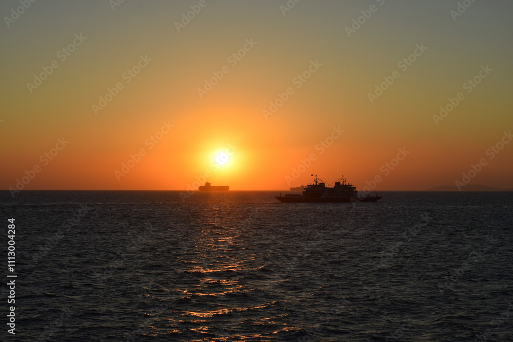 ships on the horizon at sunset ships on the horizon at sunset