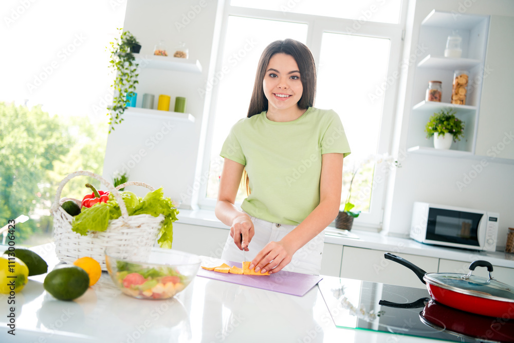 Young woman girl preparing a healthy meal in a bright and modern kitchen Young woman girl preparing a healthy meal in a bright and modern kitchen