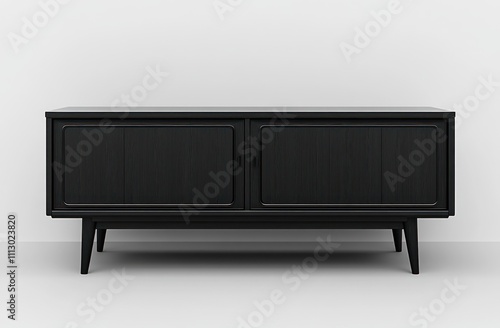 Mid-century modern black wooden sideboard with two doors and tapered legs against a white wall.