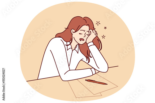 Tired girl student sleeps sitting at table with papers while filling out test or preparing for exams. Concept of burnout and overload during training before college or university entrance exams
