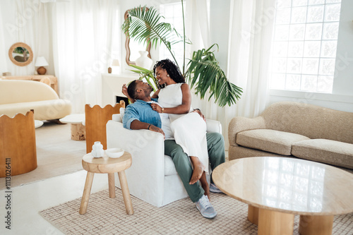 We love boding on the couch at home as i sit on my husband's lap photo