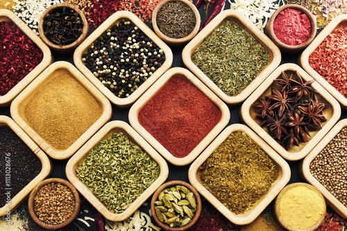 Fototapeta Naklejka Na Ścianę i Meble -  Colorful mix of herb and spice varieties: curry and coriander, turmeric and cumin, paprika and pepper, mustard and salt, cardamon and oregano and saffron. Food ingredients background