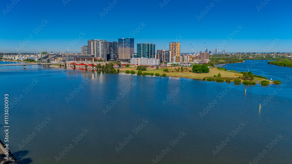 Obraz premium Panorama Aerial view above Rhodes with views to Meadowbank and Olympic park and Wentworth Point and Concord West with Parramatta River in Sydney NSW Australia
