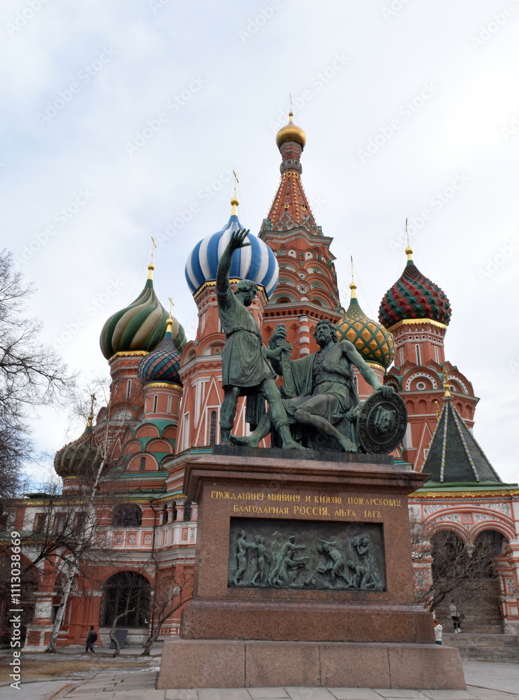 Fototapeta premium The Monument to Minin and Pozharsky is a bronze statue designed by Ivan Martos and located on the Red Square in Moscow, Russia, in front of Saint Basil's Cathedral.