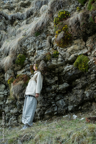 Girl leaning on the rocks photo