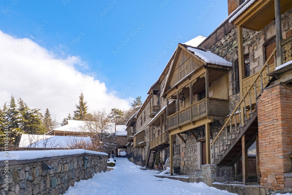 Architecture Armenia. Winter in Dilijan. Stone building with wooden decorations. Tavush region in Armenia. Dilijan on sunny day. Sights Armenia. Mountain climatic resort. Christmas weekend in Dilijan Architecture Armenia. Winter in Dilijan. Stone building with wooden decorations. Tavush region in Armenia. Dilijan on sunny day. Sights Armenia. Mountain climatic resort. Christmas weekend in Dilijan