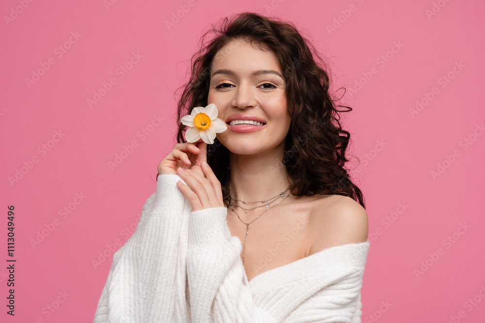 woman on pink background isolated in white knitted sweater holding flower spring summer trend fashion woman on pink background isolated in white knitted sweater holding flower spring summer trend fashion