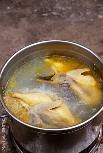 Chicken and duck soup cooking,closeup photo