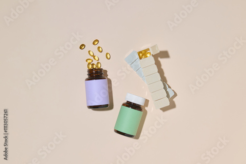 Vitamin Bottles and Pills Laid Out on a Beige Background photo