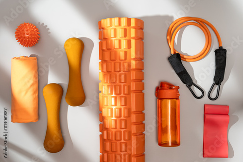 Array of fitness and yoga equipment in vibrant colors photo