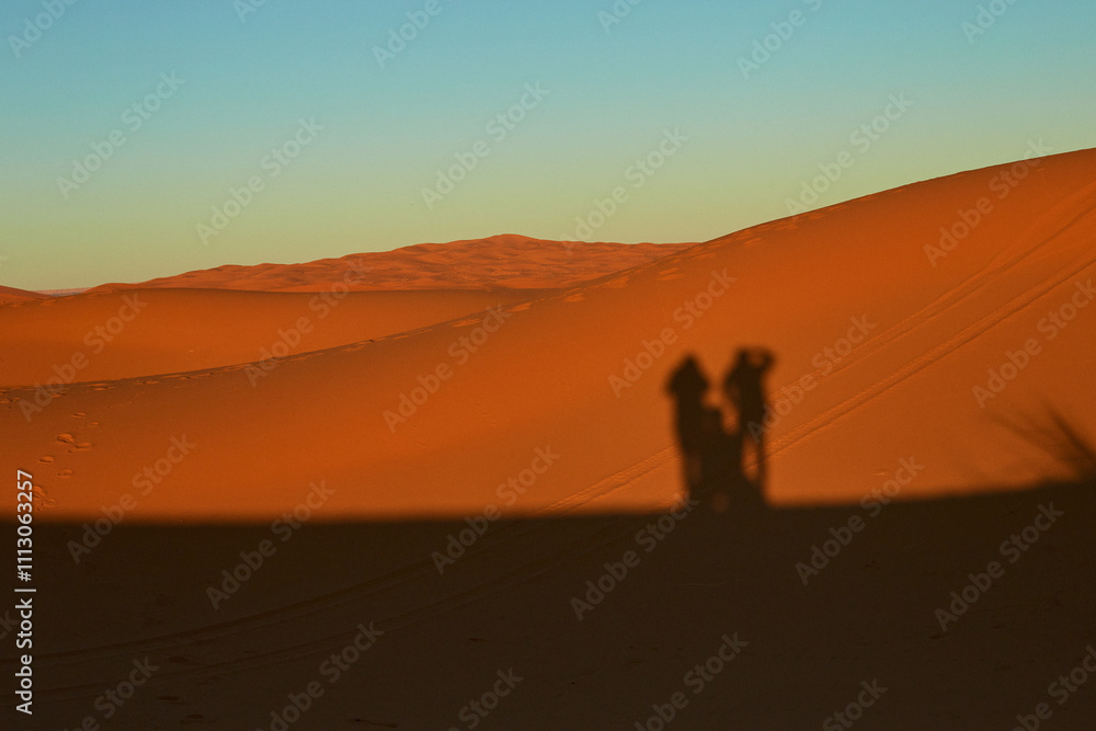 Shadows of Three People on Desert Dune
Shadows of Three People on Desert Dune