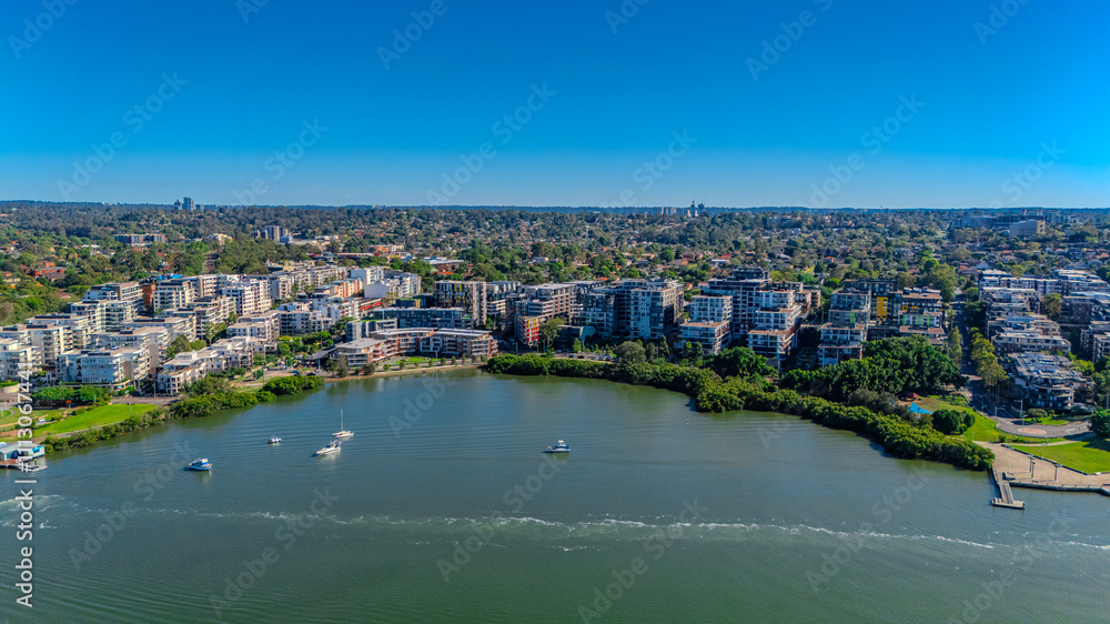 Fototapeta premium Panorama Aerial view above Rhodes with views to Meadowbank and Olympic park and Wentworth Point and Concord West with Parramatta River in Sydney NSW Australia