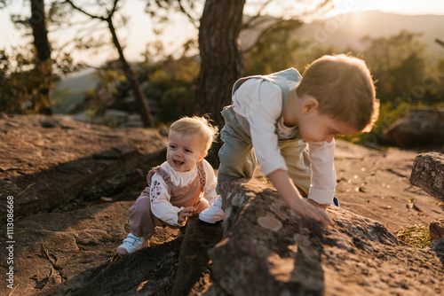 Toddlers exploring nature on a sunny day photo