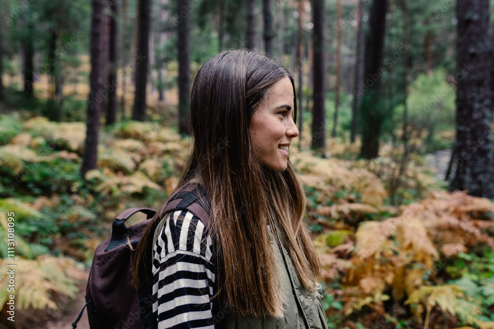 Profile portrait of a cheerful hiker admiring the scenery Profile portrait of a cheerful hiker admiring the scenery
