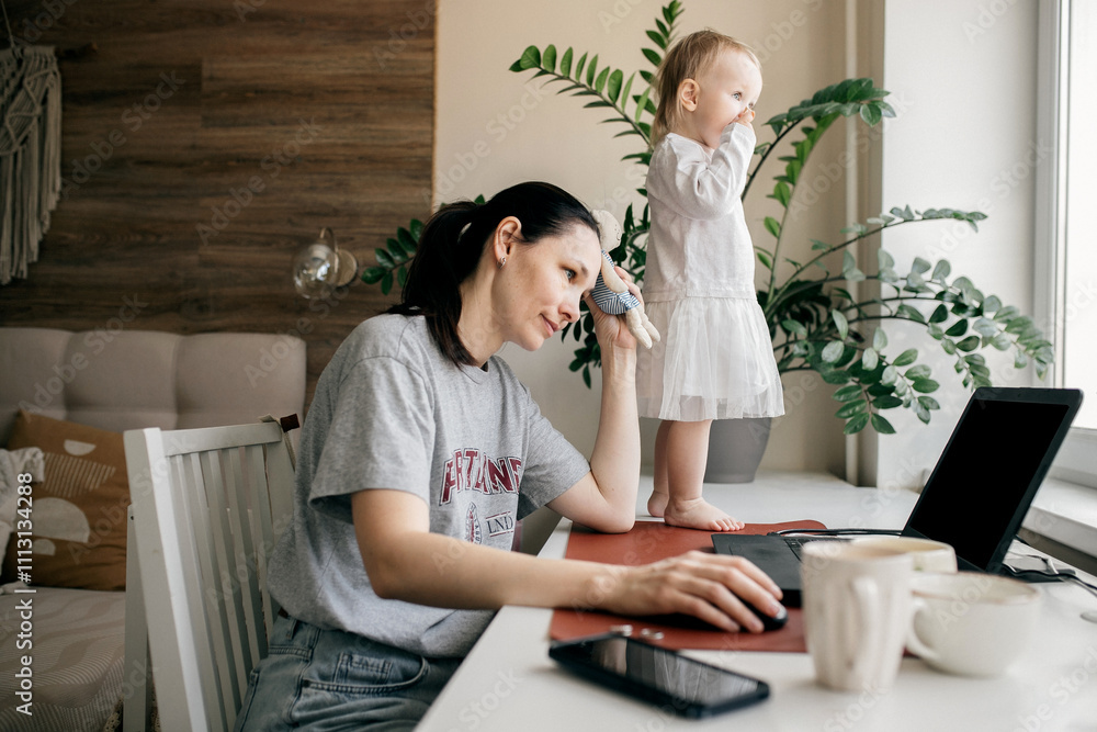 Mother is working at computer with the child. Mother is working at computer with the child.