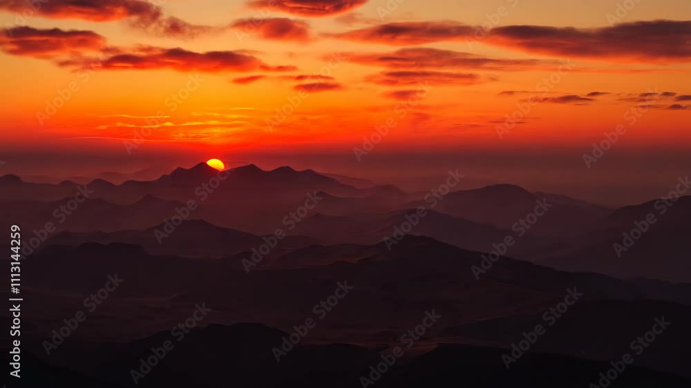 Mountain range at sunset with vibrant red Mountain range at sunset with vibrant red