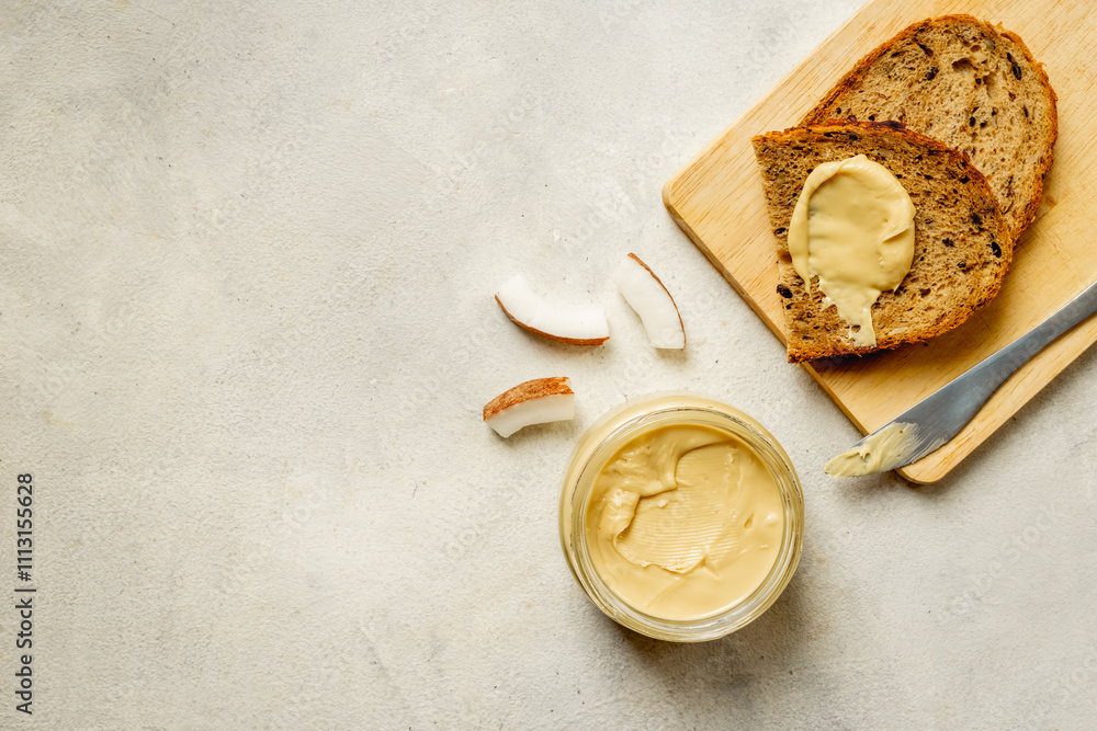 Vegan coconut butter cream with multigrain bread. Sugar and lactose free breakfast Vegan coconut butter cream with multigrain bread. Sugar and lactose free breakfast