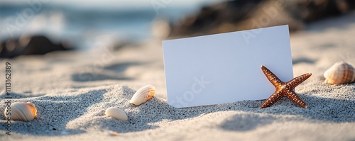 White card on the beach with a shell photo