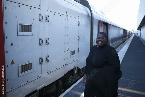 Winter traveler awaits at the train platform