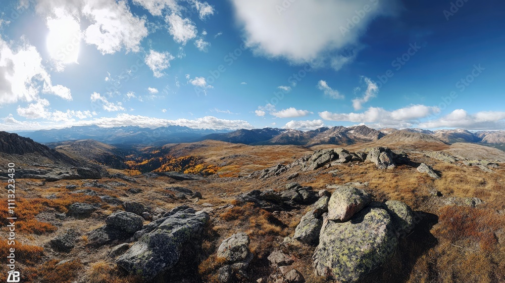 Fototapeta premium A sweeping panoramic shot of the Continental Divide in Colorado during autumn, showcasing vibrant fall colors and dramatic mountain scenery.