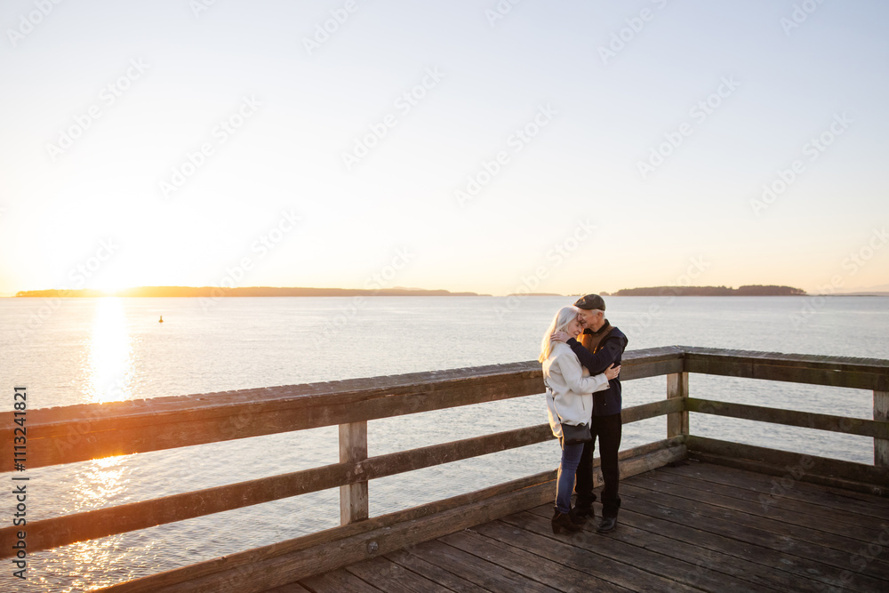 Romantic Couple Embracing on Scenic Wooden Pier at Sunset Romantic Couple Embracing on Scenic Wooden Pier at Sunset