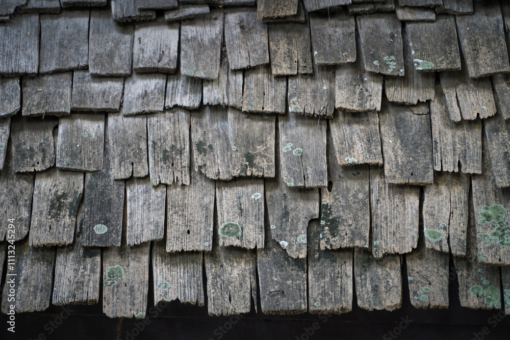 Wooden roof tiles used in Asian building weathered and bleached through sun and rain Wooden roof tiles used in Asian building weathered and bleached through sun and rain