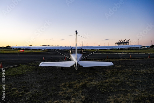 Small aircraft at airport hangar