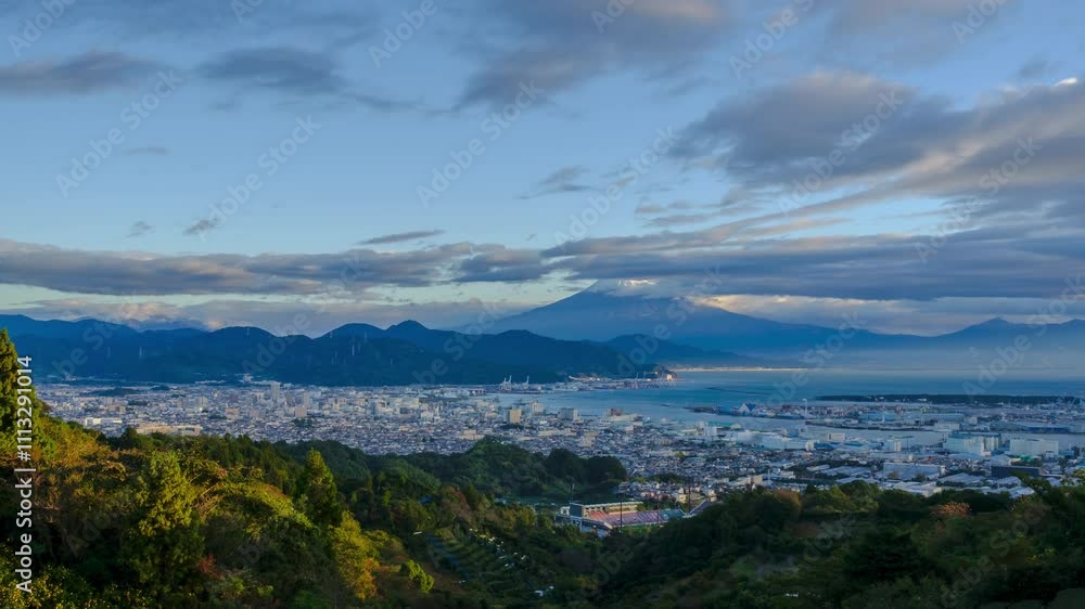 Time lapse aerial view city industry and port harbor in Shizuoka City at sunset Mountain Fuji with cloud sky backgrounds, 4k video Time lapse aerial view city industry and port harbor in Shizuoka City at sunset Mountain Fuji with cloud sky backgrounds, 4k video