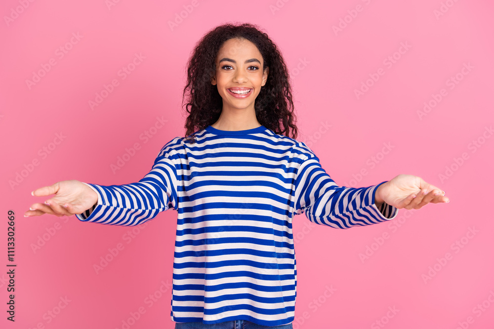 Portrait of nice young girl arms welcome you wear striped pullover isolated on pink color background Portrait of nice young girl arms welcome you wear striped pullover isolated on pink color background